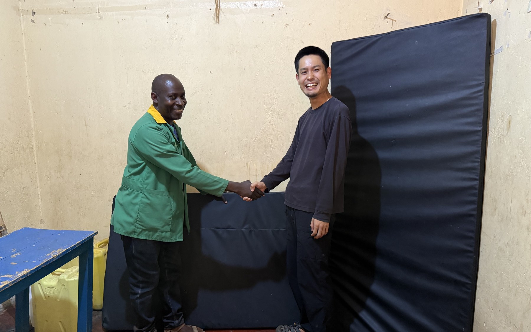 Kake and a CeSA staff member with the new therapy mats